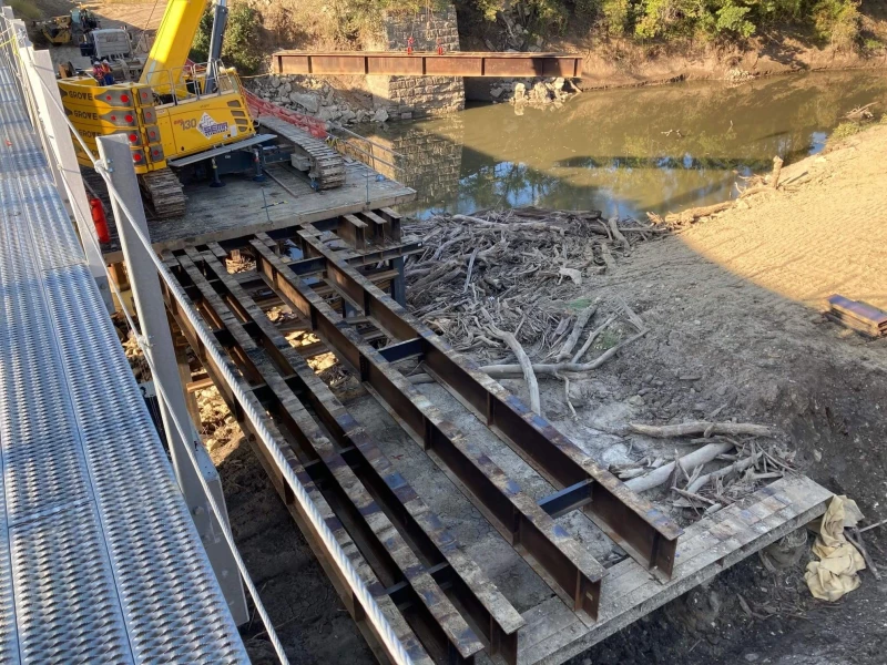 Photo is taken during the removal of the temporary trestle Bridge utilized to build the new 129.2 structure.  This riverbed was prone to flash flooding and heavy debris flows, it was know to raise 15 feet in less than a 12 hour period during heavy rain events.