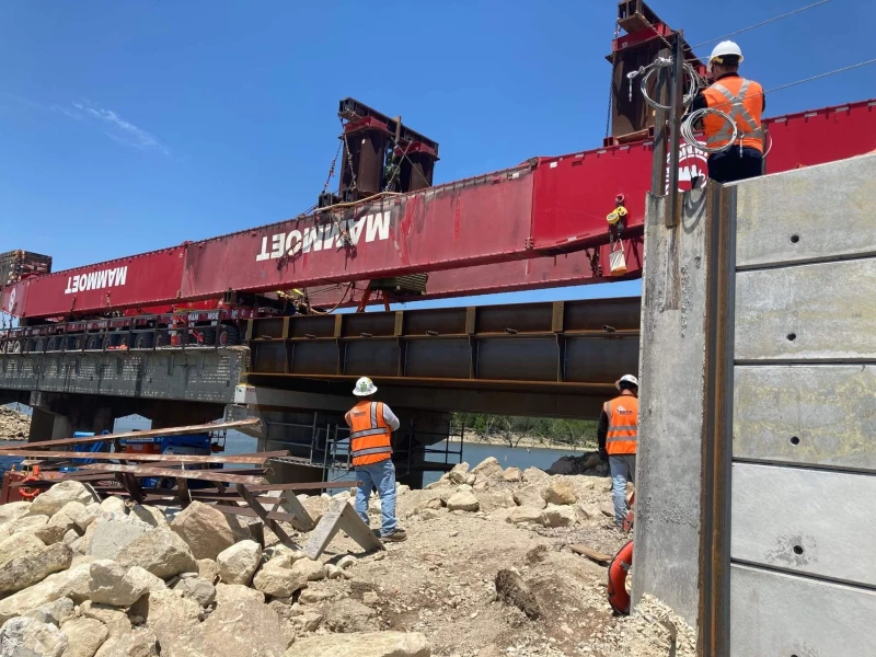 Photo is taken during the Installation of the New 166.3 Steel Bridge over lake Eldorado.  Project was all conducted along a causeway in the middle of the lake on a work surface 28 feet wide at its widest point.